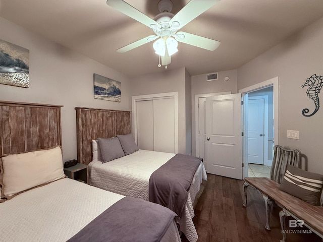 28105 Perdido Beach Blvd Unit C211, Orange Beach, AL 36561 - bedroom with ceiling fan, a closet, visible vents, and wood finished floors