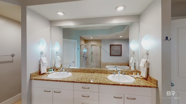 28105 Perdido Beach Blvd Unit C211, Orange Beach, AL 36561 - full bathroom with double vanity, a garden tub, a sink, and a stall shower