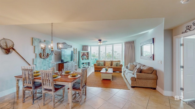28105 Perdido Beach Blvd Unit C211, Orange Beach, AL 36561 - dining room featuring a wall of windows, baseboards, light tile patterned flooring, and ceiling fan with notable chandelier