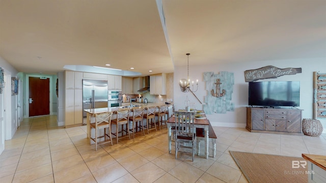28105 Perdido Beach Blvd Unit C211, Orange Beach, AL 36561 - dining space with recessed lighting, a notable chandelier, baseboards, and light tile patterned flooring