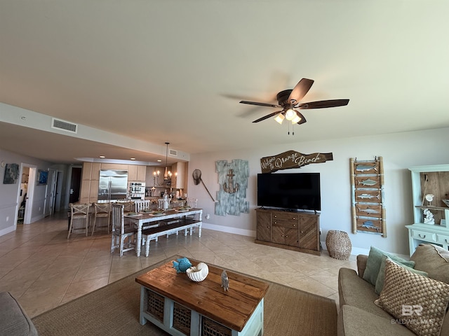 28105 Perdido Beach Blvd Unit C211, Orange Beach, AL 36561 - living room with light tile patterned floors, visible vents, baseboards, and a ceiling fan