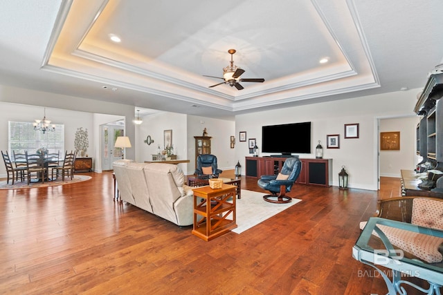 8664 Foxtail Loop, Pensacola, FL 32526 - living room with a raised ceiling, ceiling fan, a chandelier, wood finished floors, and recessed lighting