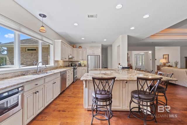 8664 Foxtail Loop, Pensacola, FL 32526 - kitchen with a sink, a breakfast bar, appliances with stainless steel finishes, healthy amount of natural light, and recessed lighting