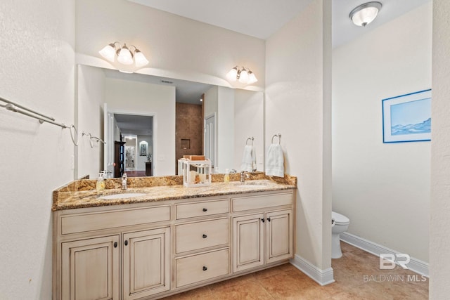 8664 Foxtail Loop, Pensacola, FL 32526 - full bathroom featuring tile patterned flooring, toilet, double vanity, and baseboards