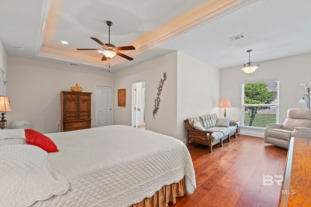 8664 Foxtail Loop, Pensacola, FL 32526 - bedroom with hardwood / wood-style flooring, a raised ceiling, and ceiling fan