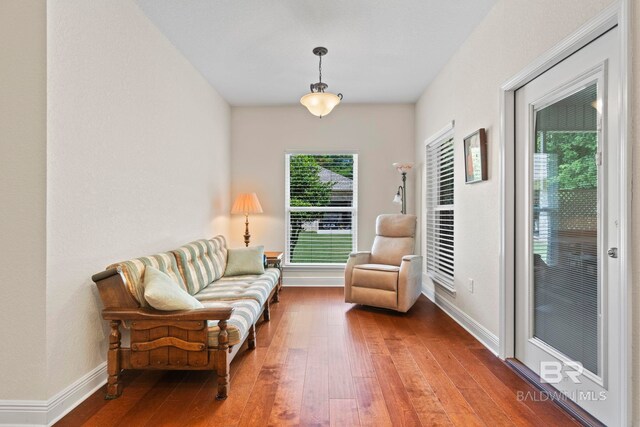 8664 Foxtail Loop, Pensacola, FL 32526 - living area featuring hardwood / wood-style flooring and baseboards