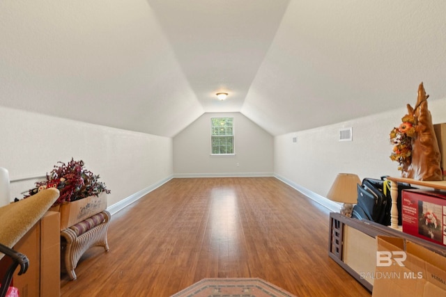 8664 Foxtail Loop, Pensacola, FL 32526 - additional living space with wood finished floors, vaulted ceiling, and baseboards
