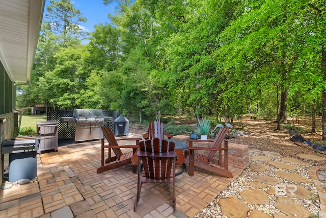 8664 Foxtail Loop, Pensacola, FL 32526 - view of patio / terrace with grilling area and a fire pit