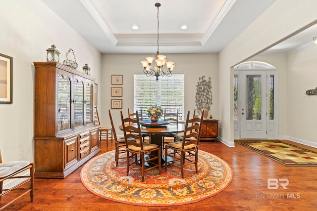 8664 Foxtail Loop, Pensacola, FL 32526 - dining area featuring a chandelier, wood finished floors, crown molding, a raised ceiling, and recessed lighting