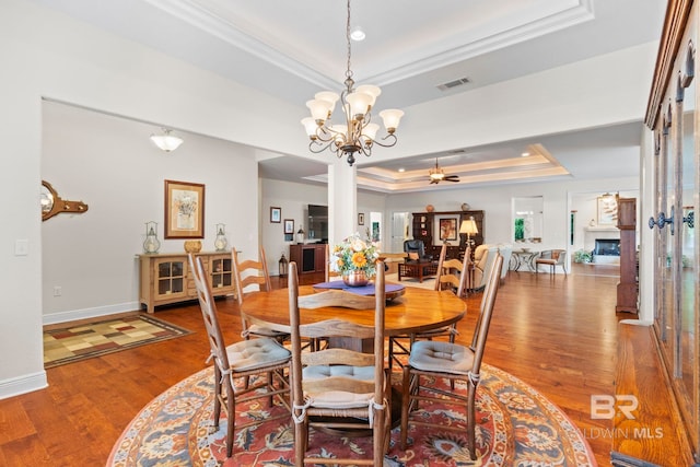 8664 Foxtail Loop, Pensacola, FL 32526 - dining space with a tray ceiling, ornamental molding, wood finished floors, a ceiling fan, and baseboards