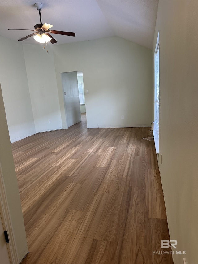 1010 E Hamilton Bridges Dr, Mobile, AL 36695 - spare room featuring ceiling fan, wood finished floors, and vaulted ceiling