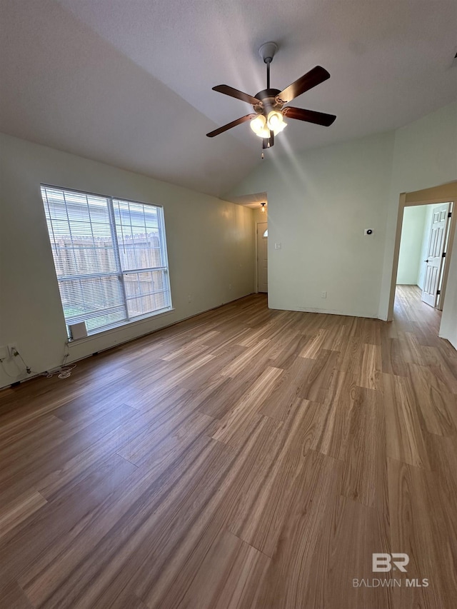 1010 E Hamilton Bridges Dr, Mobile, AL 36695 - spare room with wood finished floors, a ceiling fan, and vaulted ceiling