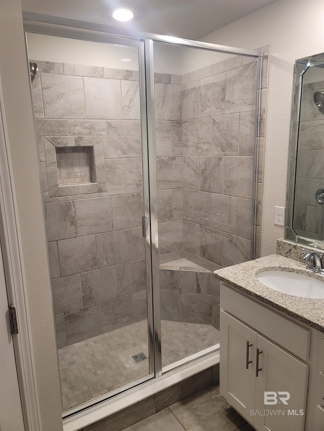 23965 Cottage Loop, Orange Beach, AL 36561 - bathroom with vanity and a shower stall