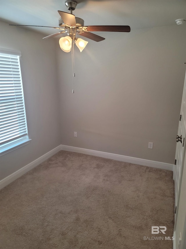 23965 Cottage Loop, Orange Beach, AL 36561 - empty room with a ceiling fan, light carpet, a smoke detector, and baseboards