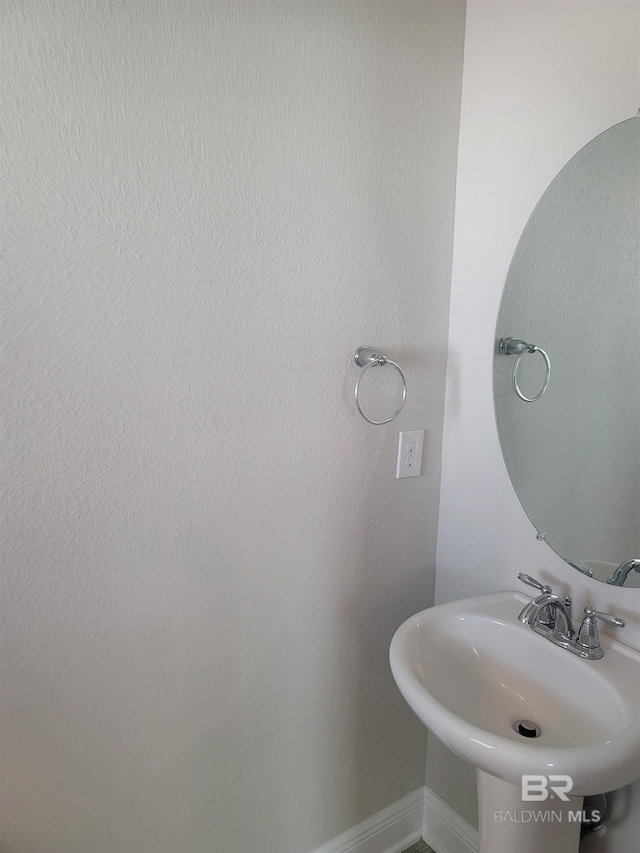 23965 Cottage Loop, Orange Beach, AL 36561 - bathroom with a sink and baseboards