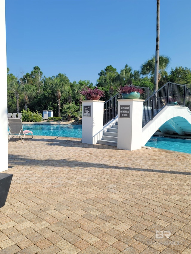 23965 Cottage Loop, Orange Beach, AL 36561 - community pool featuring a patio