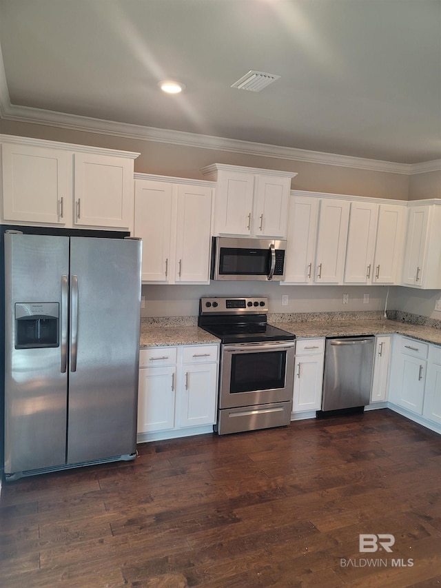 23965 Cottage Loop, Orange Beach, AL 36561 - kitchen featuring stainless steel appliances, ornamental molding, white cabinetry, light stone counters, and recessed lighting