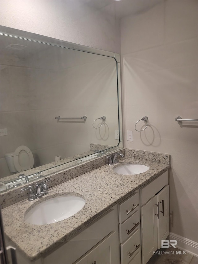 23965 Cottage Loop, Orange Beach, AL 36561 - bathroom featuring double vanity and toilet
