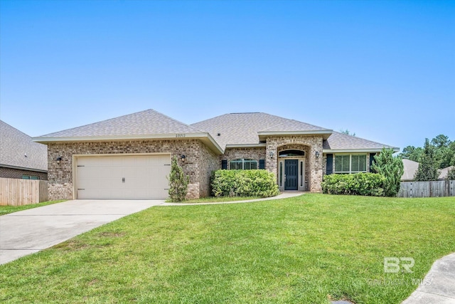 ranch-style house with a garage and a front yard