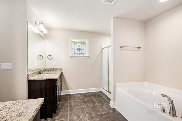 bathroom featuring tile patterned flooring, vanity, and separate shower and tub