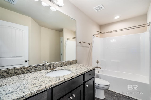 full bathroom featuring vanity, tile patterned flooring, shower / washtub combination, and toilet