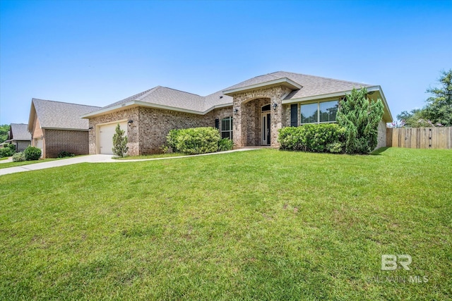 ranch-style house with a garage and a front yard