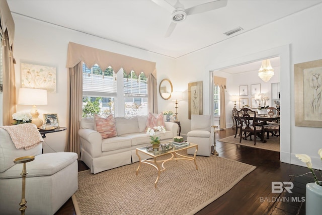 living room with dark hardwood / wood-style flooring and ceiling fan