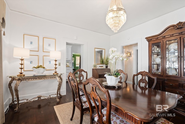 dining space featuring a chandelier and hardwood / wood-style floors