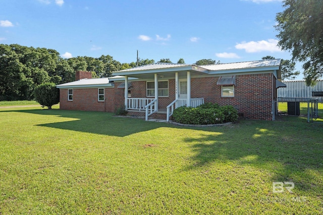 ranch-style house with a porch and a front yard