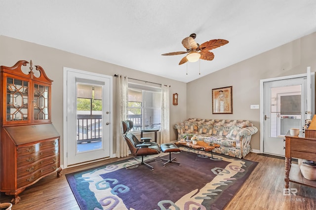 2200 W 2nd St Unit 301-C, Gulf Shores, AL 36542 - living area with vaulted ceiling, wood finished floors, and a ceiling fan