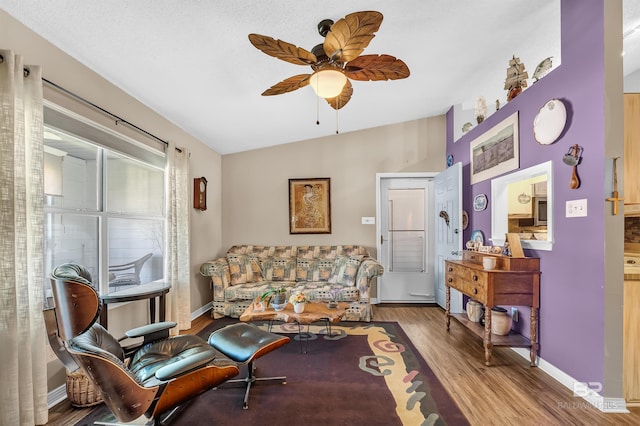 2200 W 2nd St Unit 301-C, Gulf Shores, AL 36542 - living area with wood finished floors, ceiling fan, and vaulted ceiling