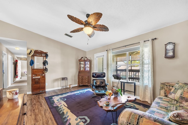 2200 W 2nd St Unit 301-C, Gulf Shores, AL 36542 - living area with lofted ceiling, wood finished floors, and ceiling fan