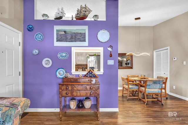 2200 W 2nd St Unit 301-C, Gulf Shores, AL 36542 - dining space with a high ceiling and wood finished floors