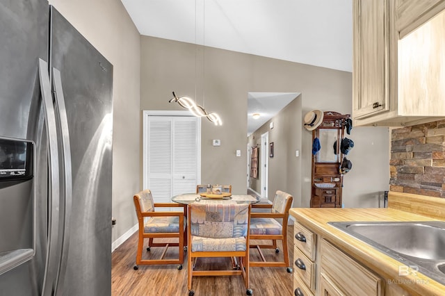 2200 W 2nd St Unit 301-C, Gulf Shores, AL 36542 - dining area with wood finished floors and lofted ceiling