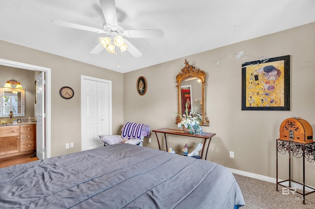 2200 W 2nd St Unit 301-C, Gulf Shores, AL 36542 - bedroom with ensuite bath, a ceiling fan, and light carpet