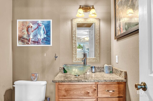 2200 W 2nd St Unit 301-C, Gulf Shores, AL 36542 - half bathroom with vanity and a textured wall