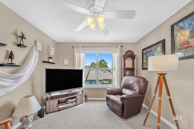 2200 W 2nd St Unit 301-C, Gulf Shores, AL 36542 - living room with ceiling fan, carpet, and a textured ceiling