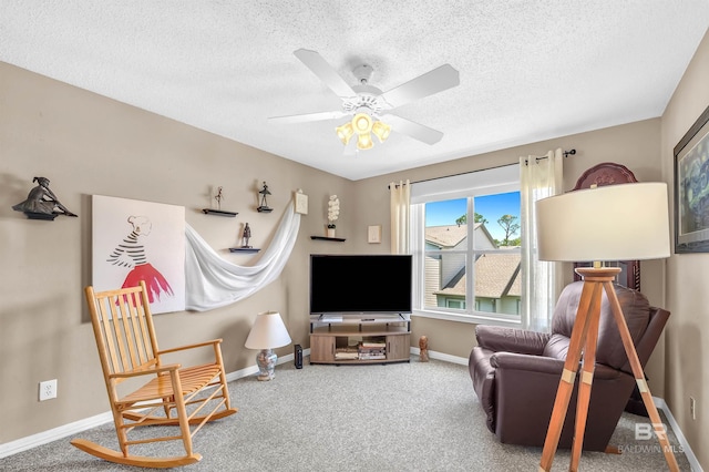 2200 W 2nd St Unit 301-C, Gulf Shores, AL 36542 - sitting room with carpet floors, a textured ceiling, and a ceiling fan