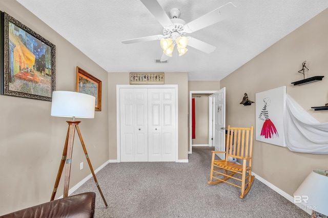 2200 W 2nd St Unit 301-C, Gulf Shores, AL 36542 - sitting room featuring ceiling fan and carpet floors