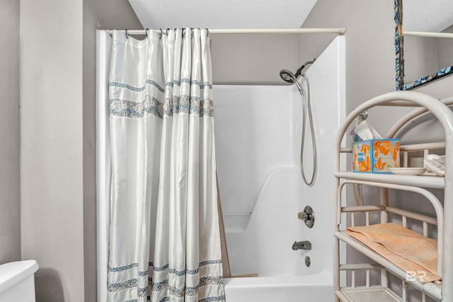 2200 W 2nd St Unit 301-C, Gulf Shores, AL 36542 - full bath with shower / tub combo and a textured ceiling