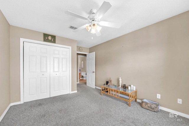 2200 W 2nd St Unit 301-C, Gulf Shores, AL 36542 - carpeted bedroom with a closet, a ceiling fan, and a textured ceiling