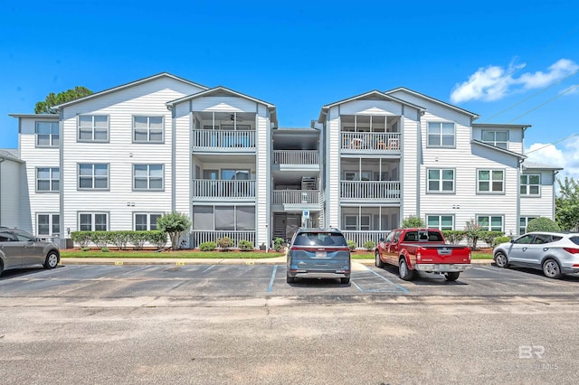 2200 W 2nd St Unit 301-C, Gulf Shores, AL 36542 - view of building exterior featuring uncovered parking