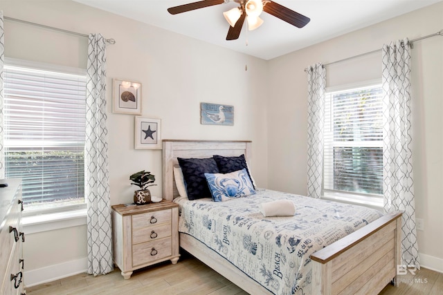 bedroom featuring ceiling fan and light hardwood / wood-style flooring