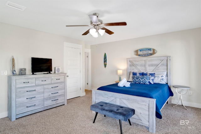 bedroom featuring ceiling fan and light carpet