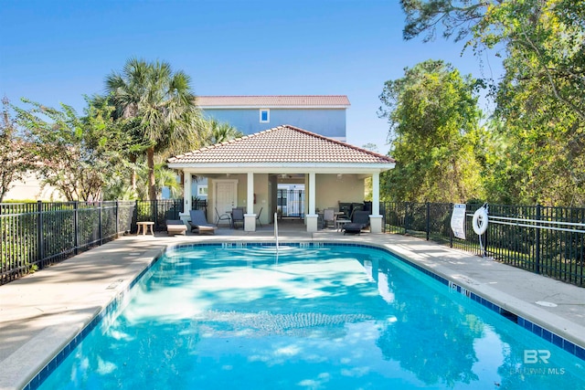 view of swimming pool with a patio