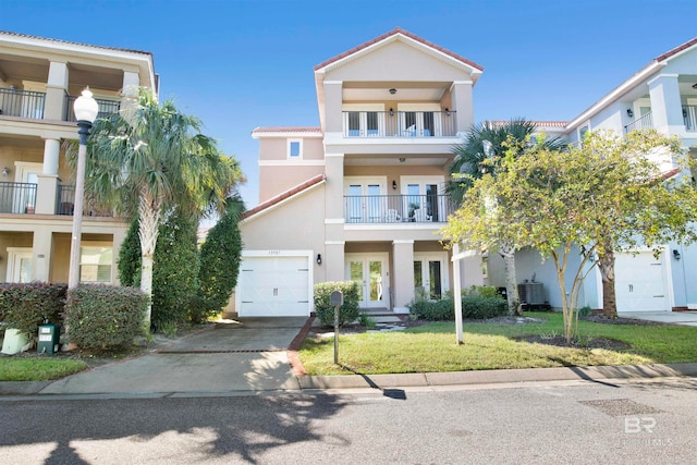 view of front of house featuring french doors and a front lawn