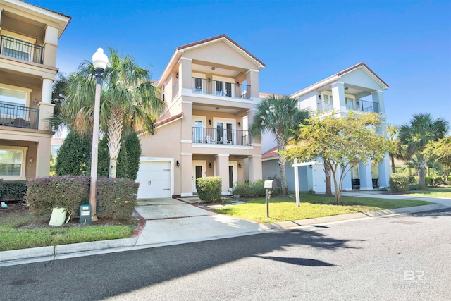 view of front of property with a garage and a front yard