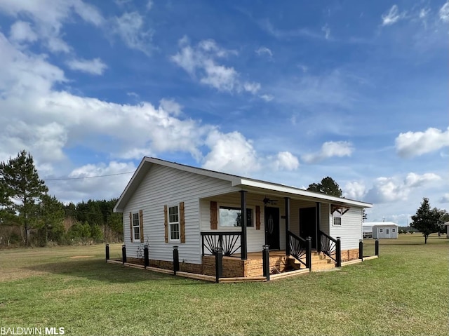 15082 County Road 93, Lillian, AL 36549 - view of front of house with a porch and a front lawn