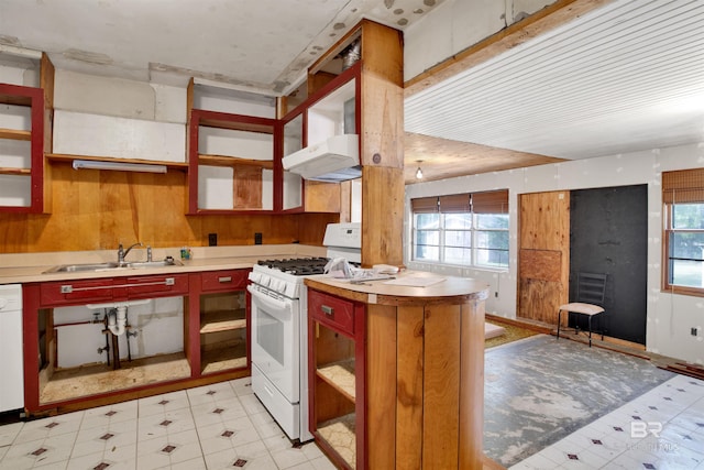 kitchen with open shelves, white appliances, a sink, extractor fan, and light floors