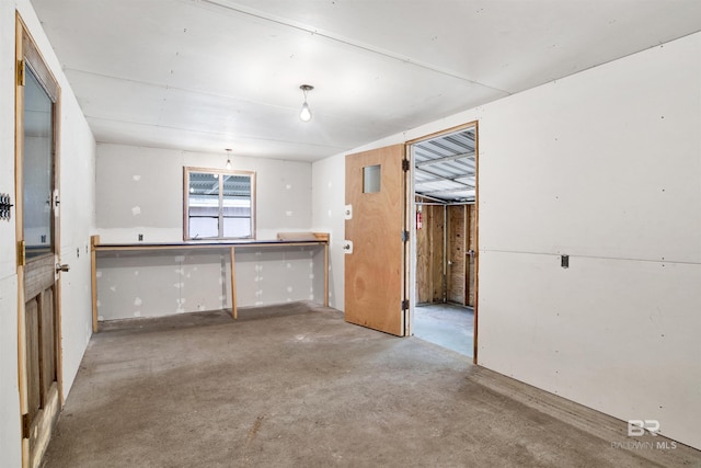 kitchen with unfinished concrete flooring